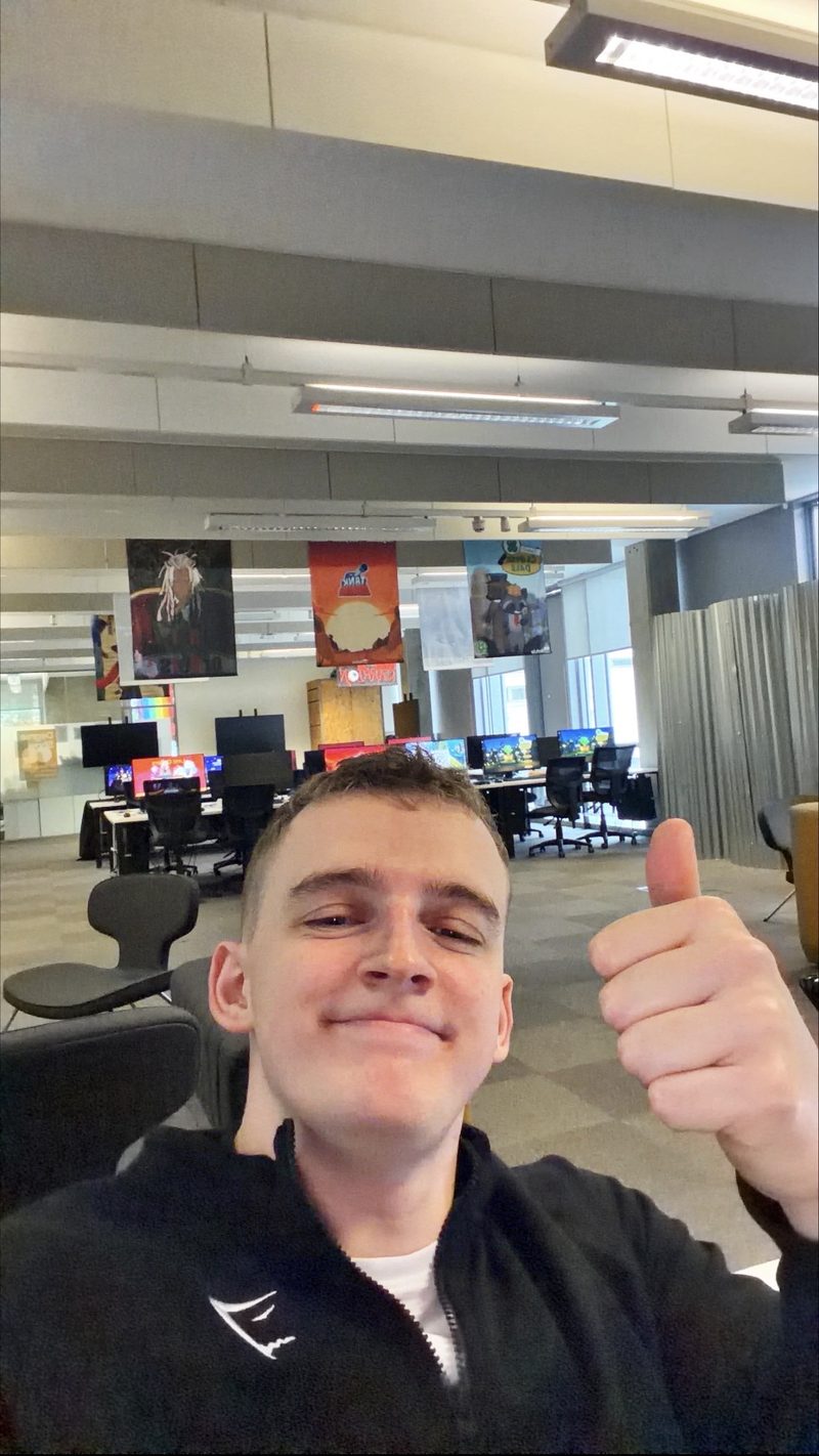 Brandon giving a thumbs up in a computer room at the University of Salford
